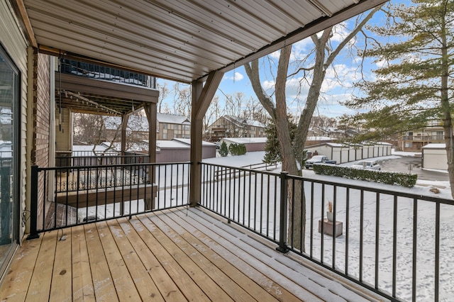 view of snow covered deck