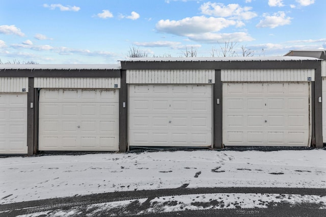 view of snow covered garage