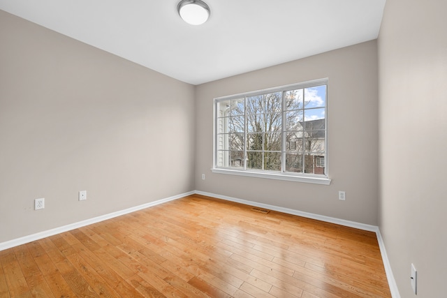 unfurnished room featuring light wood-type flooring