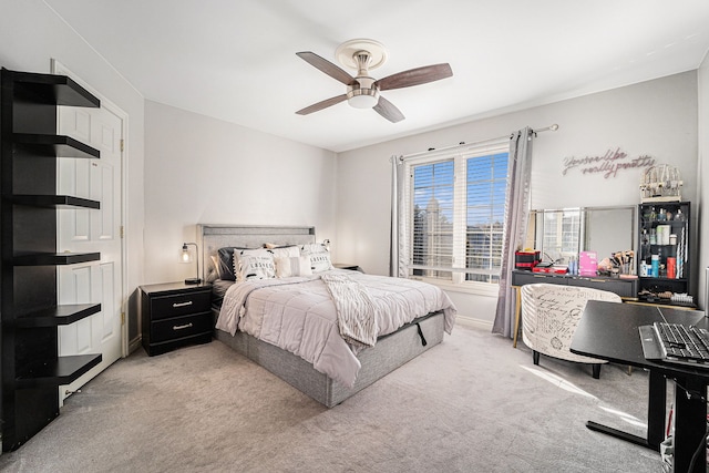 bedroom featuring ceiling fan and light colored carpet