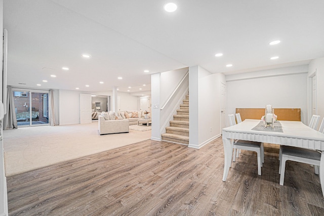 dining space with hardwood / wood-style flooring