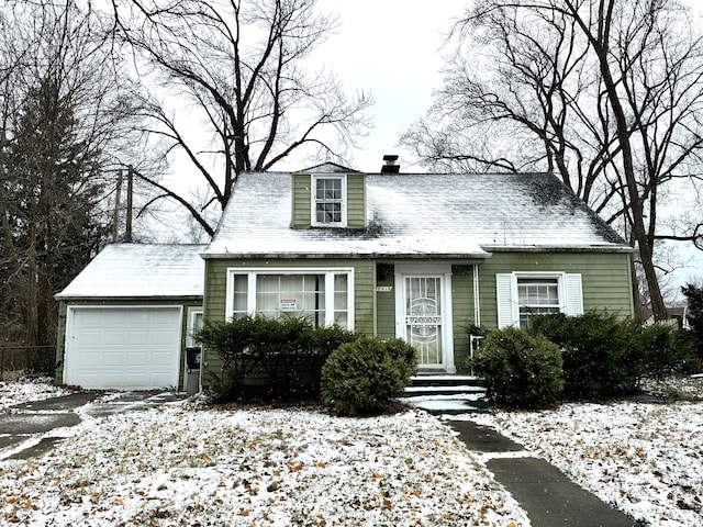 new england style home featuring a garage