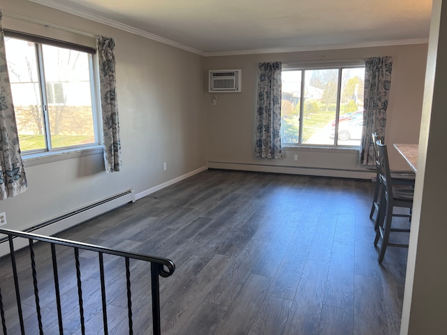 spare room featuring a wall mounted air conditioner, dark hardwood / wood-style floors, baseboard heating, and crown molding