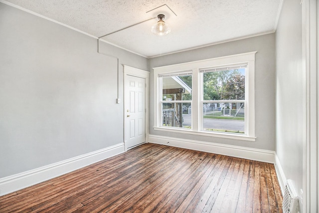 empty room featuring dark wood-type flooring