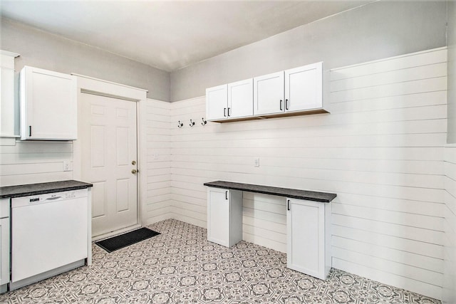 kitchen featuring dishwasher and white cabinets