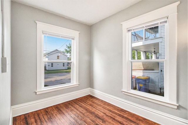 unfurnished room featuring hardwood / wood-style flooring