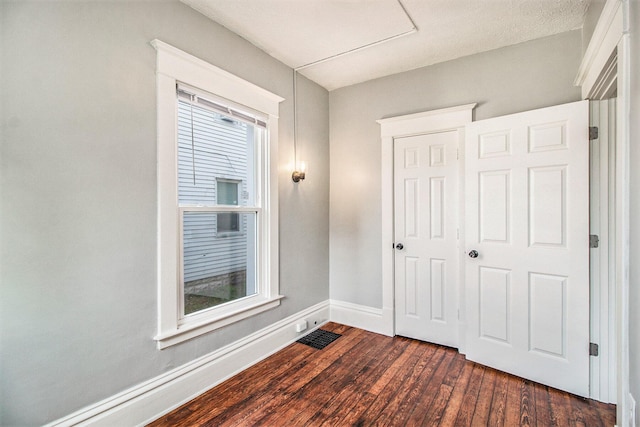 interior space with dark hardwood / wood-style flooring