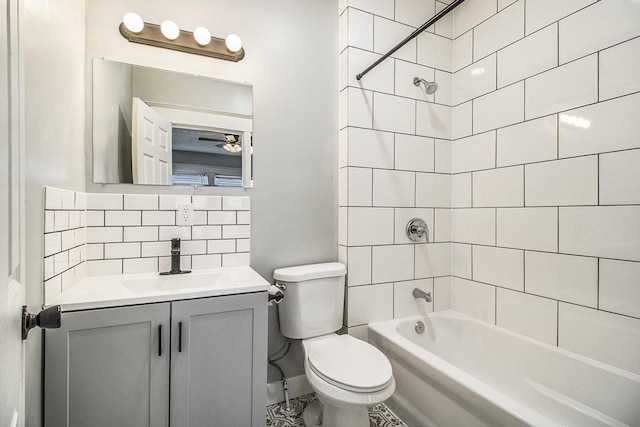 full bathroom featuring vanity, tasteful backsplash, toilet, and tiled shower / bath