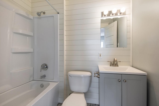 full bathroom featuring vanity, toilet, and washtub / shower combination