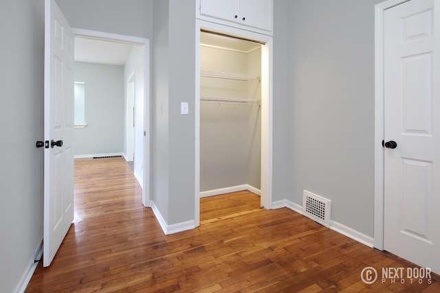 hall featuring wood-type flooring