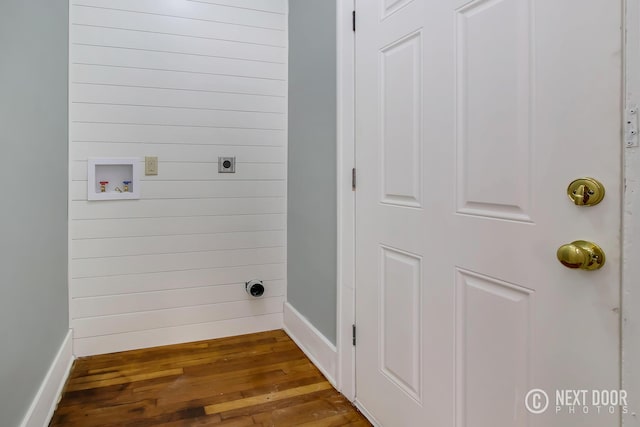 washroom with wood-type flooring and hookup for an electric dryer