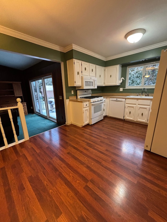 kitchen featuring white appliances, white cabinetry, and ornamental molding