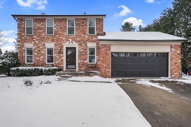 colonial inspired home featuring a garage