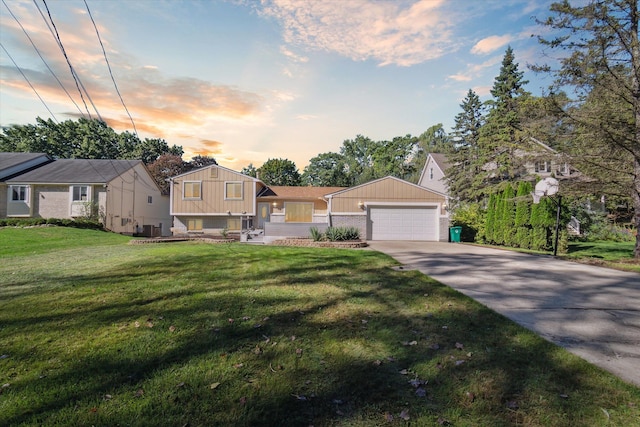 view of front of home featuring a garage and a yard