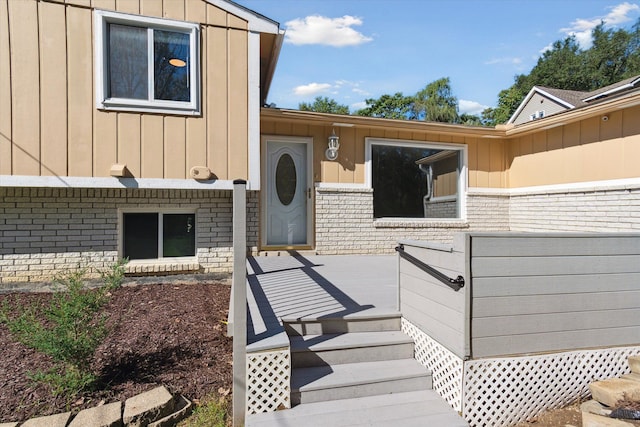 entrance to property with a wooden deck