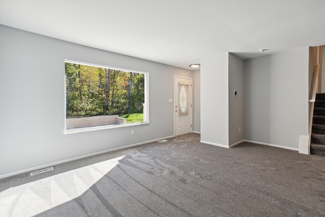 unfurnished living room with carpet flooring