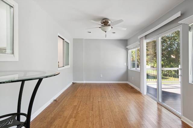 spare room with ceiling fan and light hardwood / wood-style floors