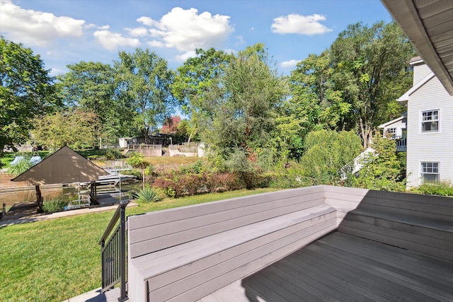 deck featuring a lawn