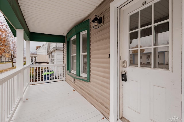 property entrance featuring covered porch