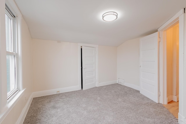 empty room featuring light carpet