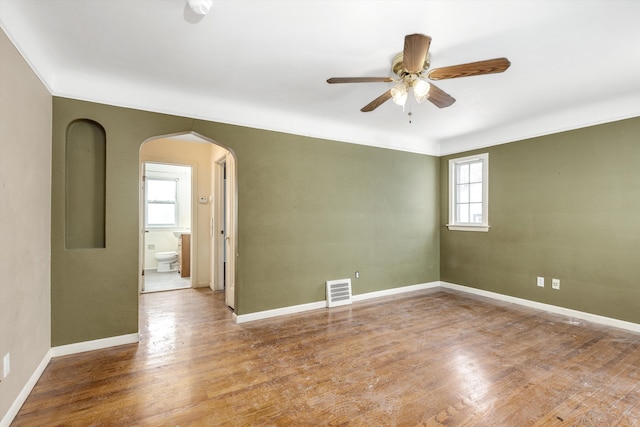 spare room featuring ceiling fan and wood-type flooring