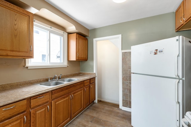 kitchen with sink and white refrigerator