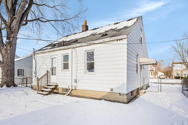 view of snow covered house