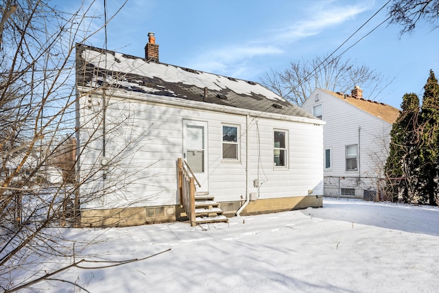 view of snow covered house