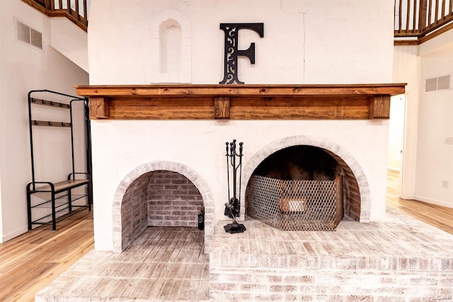 room details with a fireplace and wood-type flooring