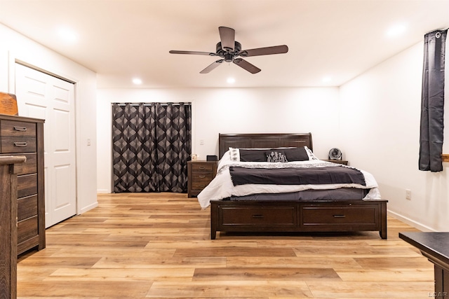 bedroom with ceiling fan and light wood-type flooring