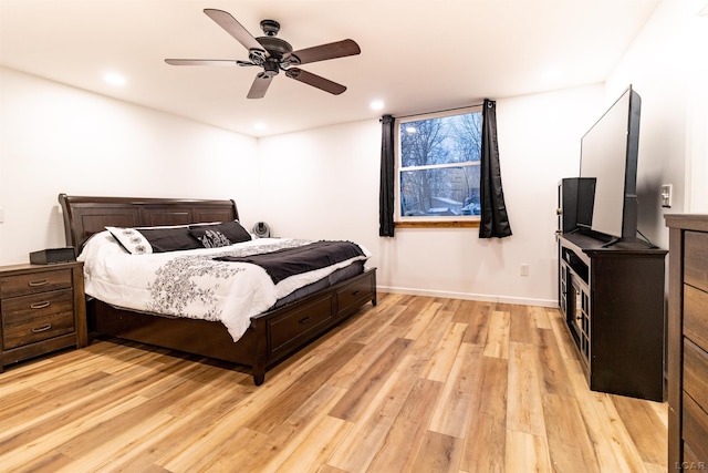 bedroom featuring light hardwood / wood-style floors and ceiling fan