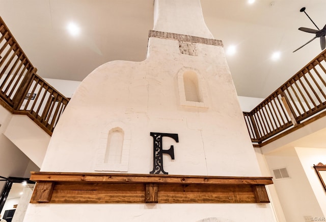 staircase featuring ceiling fan