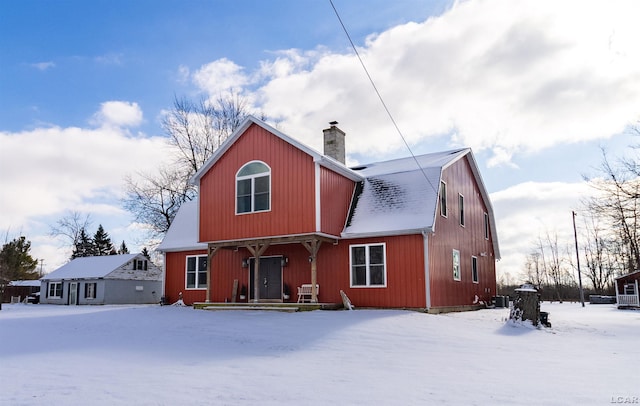 view of snow covered house