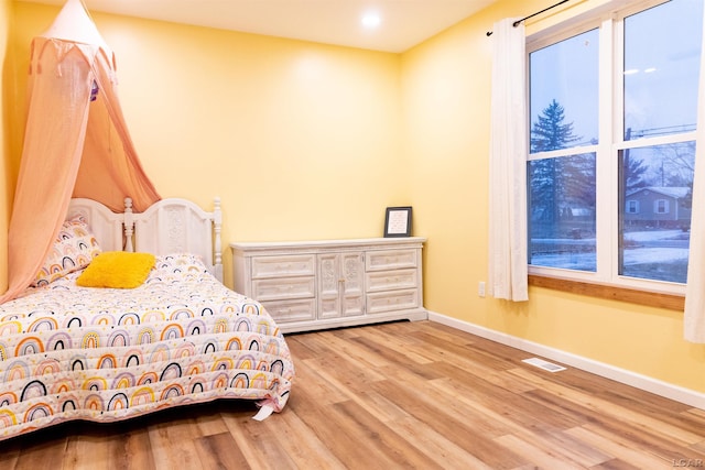 bedroom featuring light hardwood / wood-style flooring