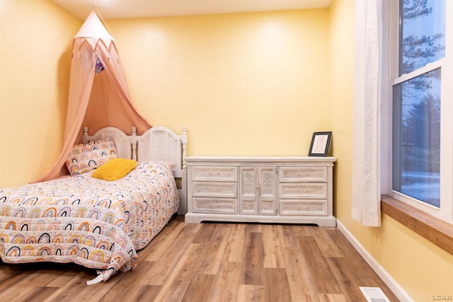 bedroom featuring light hardwood / wood-style floors