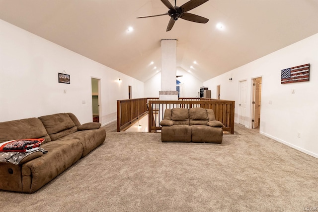 carpeted living room featuring ceiling fan and vaulted ceiling