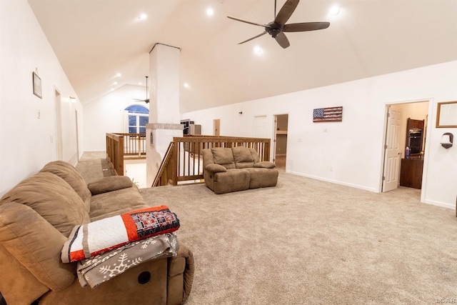 carpeted living room featuring ceiling fan and lofted ceiling