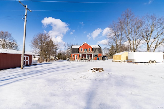 snowy yard with an outdoor structure