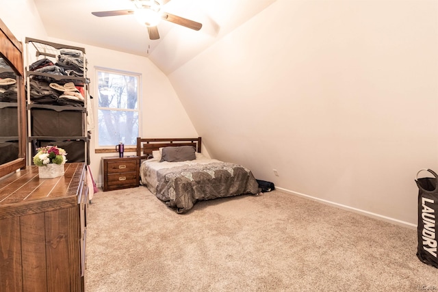 carpeted bedroom featuring ceiling fan and vaulted ceiling