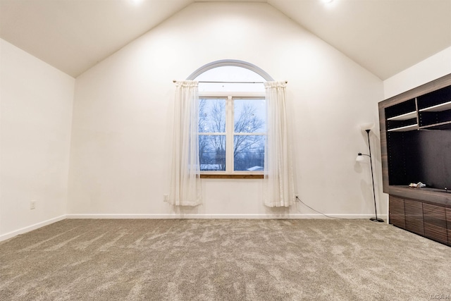 unfurnished living room featuring carpet flooring and high vaulted ceiling