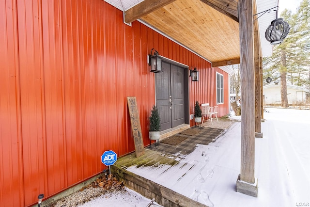 view of snow covered property entrance