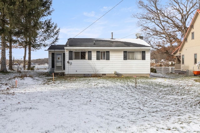 snow covered property featuring central AC unit