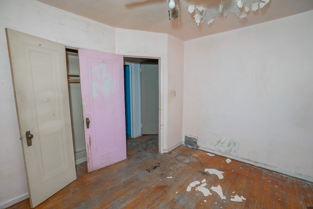 unfurnished bedroom featuring hardwood / wood-style floors