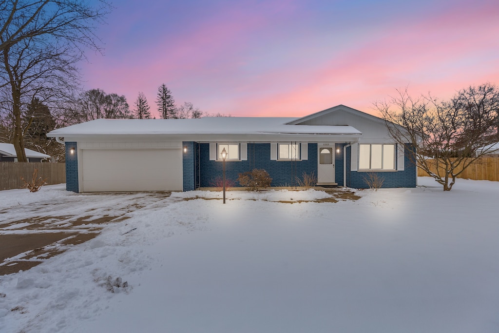 ranch-style home with a garage