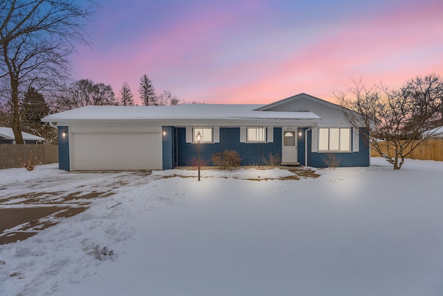 ranch-style home with a garage