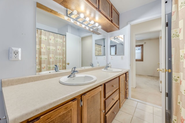 bathroom with tile patterned flooring and vanity