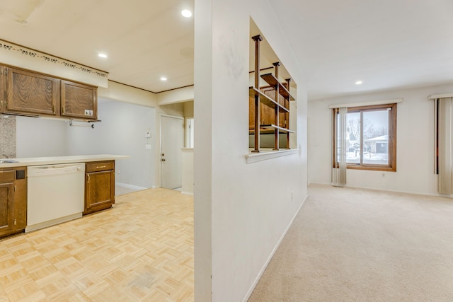 kitchen featuring white dishwasher and light parquet floors