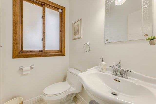 bathroom featuring sink and toilet