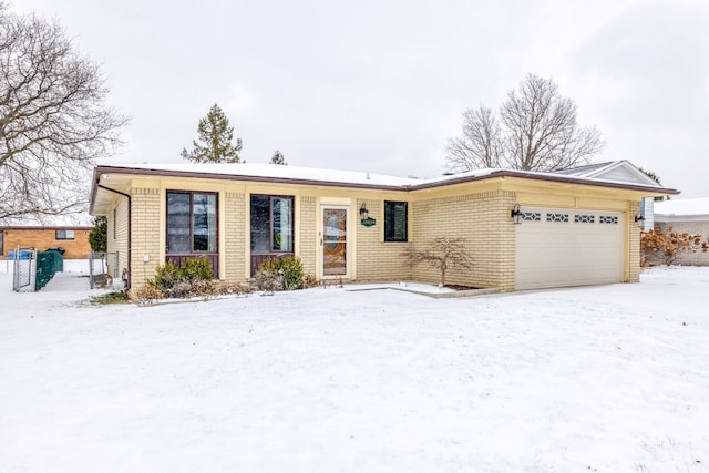 single story home featuring a garage