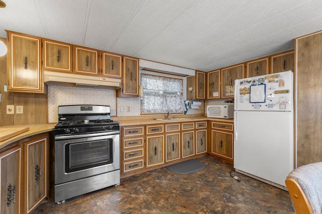 kitchen with sink and white appliances